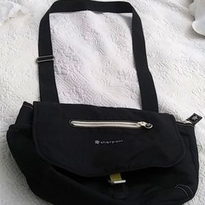 Woman's Black Sherpani crossbody handbag All material with metal slip closure
